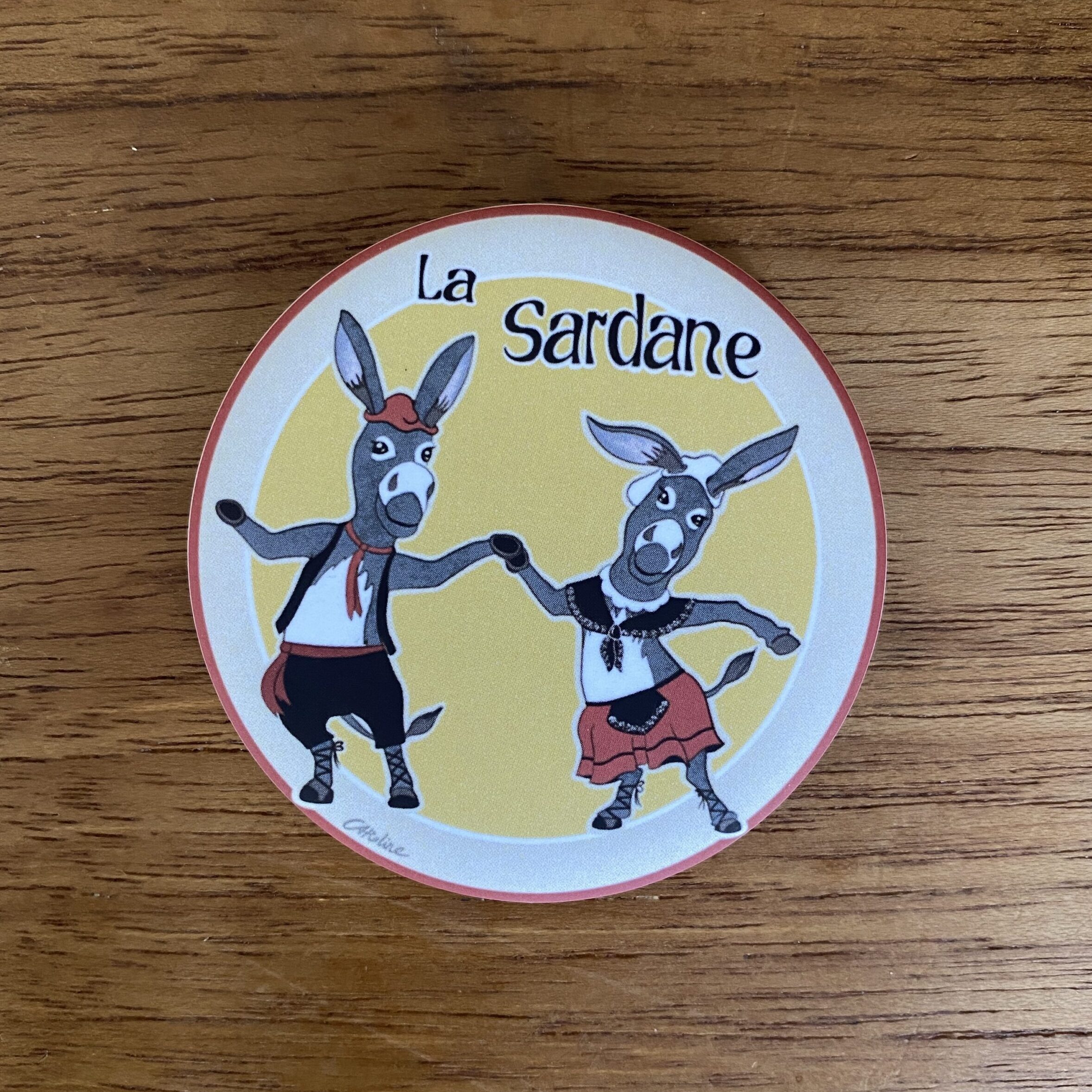 Magnet illustré représentant deux ânes catalans dansant la sardane traditionnelle catalane